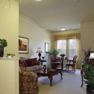 A warm and inviting living room with traditional furnishings and ample natural light.