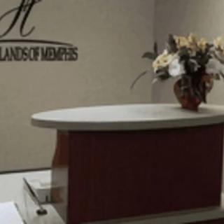 A reception desk with floral decoration in an office environment.