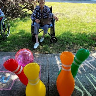 Enjoying a fun bowling game outdoors with friends.
