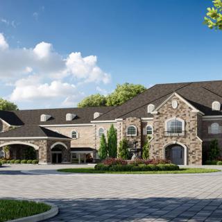 A grand stone mansion with a spacious driveway surrounded by lush greenery and a blue sky.