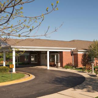 A welcoming healthcare facility with a well-maintained entrance and landscaped surroundings.