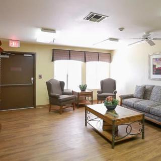 A cozy living room with comfortable seating and natural lighting.