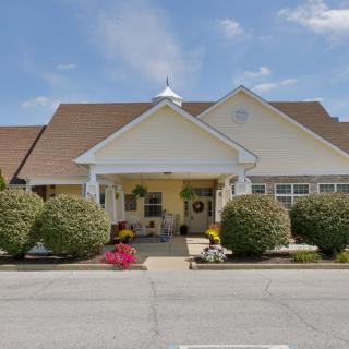 A well-maintained residential building with a welcoming entrance and landscaped surroundings.