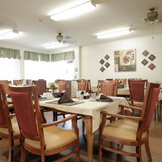 A cozy dining area with set tables and elegant decor.
