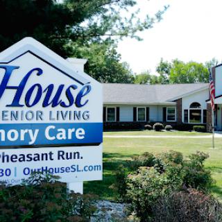 A welcoming sign for a senior living and memory care facility.
