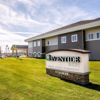 The exterior view of a modern facility with well-maintained landscaping.