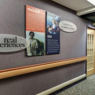 A hallway with informational posters and signage on the walls.