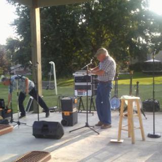 Local musicians performing at an outdoor event.
