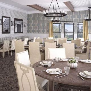 A beautifully designed dining area with elegant decor and well-arranged tables ready for guests.