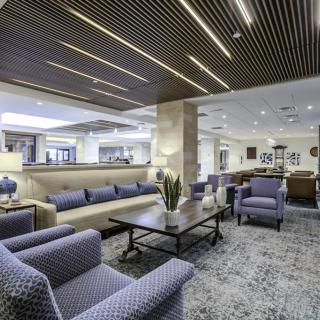 A modern lobby with comfortable seating and stylish decor.