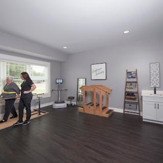 A physical therapy room equipped with various rehabilitation tools for patient treatment.