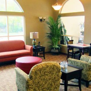 A cozy lobby area with comfortable seating and natural lighting.