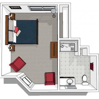 A top-down view of a bedroom and bathroom floor plan with furniture layout.