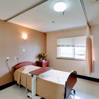 A clean and organized patient room in a healthcare facility.