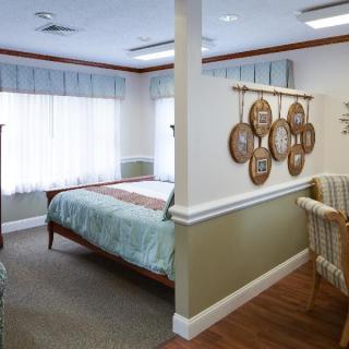 A cozy bedroom with stylish decor and natural light.