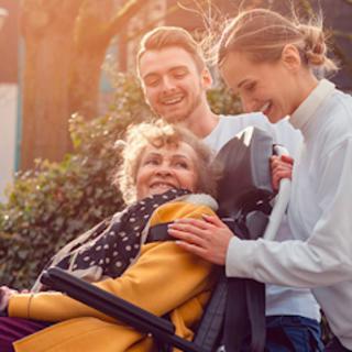 A joyful moment shared between family members outside.