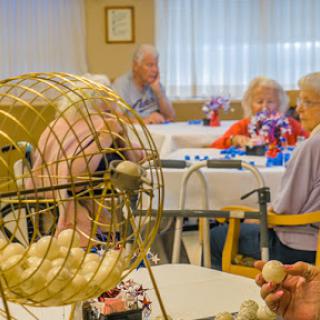 Residents enjoying a lively game of bingo at a community center.