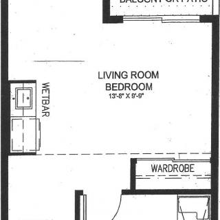 Studio apartment floor plan with living room, wet bar, and wardrobe.