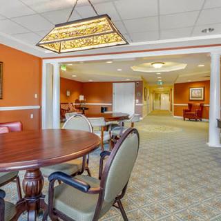 A cozy dining area with elegant seating and warm lighting.