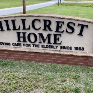 A welcoming sign for Hillcrest Home, dedicated to providing care for the elderly since 1953.