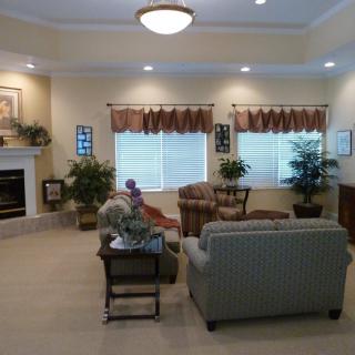 A cozy living room with comfortable seating and a fireplace.