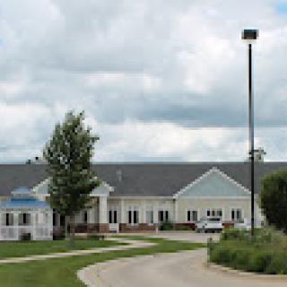 A view of a residential building on a cloudy day.