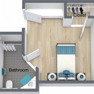 A small apartment floor plan featuring a bedroom, bathroom, and closet.