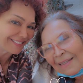 Two women smiling together for a selfie.