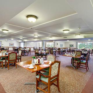 Spacious dining area with neatly arranged tables and chairs.