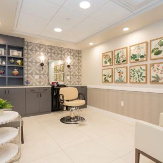 A modern hair salon interior with stylish decor and comfortable seating.