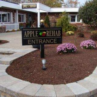 Entrance to Apple Rehab with landscaped garden.
