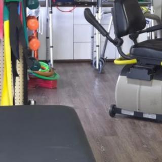 A gym space featuring various exercise equipment for fitness activities.