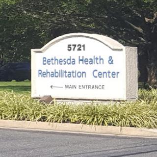 A sign for Bethesda Health & Rehabilitation Center indicating the main entrance.