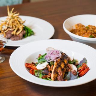 A delicious assortment of gourmet dishes elegantly presented on a dining table.