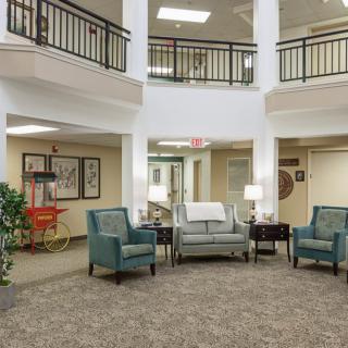 A cozy lobby with comfortable seating and warm lighting.