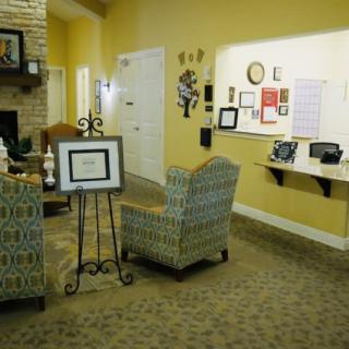 A cozy living room with comfortable chairs and warm decor.