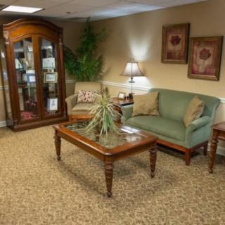 A cozy living room with a sofa, coffee table, and decorative accents.