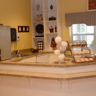 A cozy bakery counter displaying a selection of pastries.