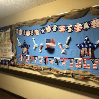 A festive bulletin board decorated for the 4th of July celebration.