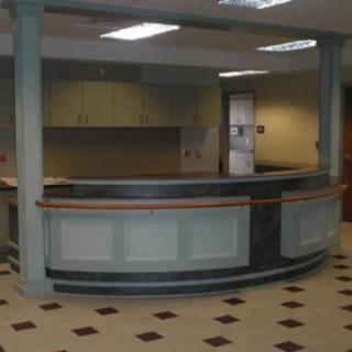 An empty reception desk in an office setting.