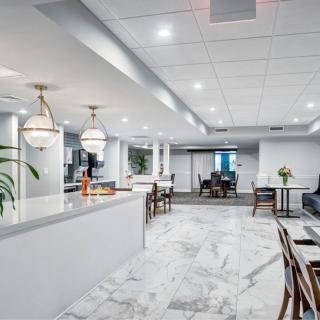 A modern office lobby with seating and elegant lighting.