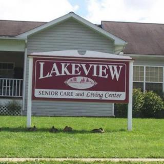 A sign for Lakeview Senior Care and Living Center in front of a building.