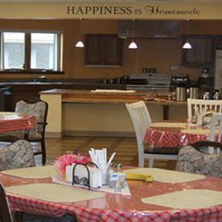 A cozy dining area with checkered tablecloths, set in a restaurant.