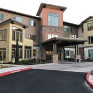 A modern commercial building entrance with contemporary architectural features.