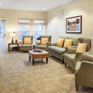 A cozy living room with comfortable seating and soft lighting.