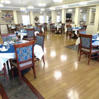 Spacious dining area with well-arranged tables and chairs.