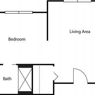 A simple floor plan showing a bedroom, living area, and bathroom.