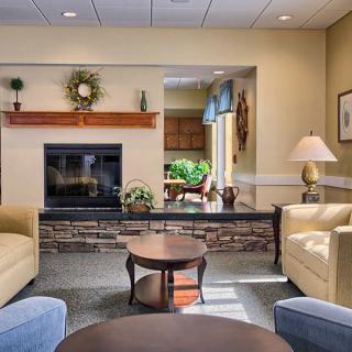 Cozy living room with a fireplace and comfortable seating.