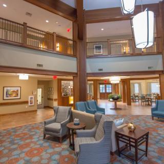 A spacious and modern hotel lobby with comfortable seating and stylish lighting.