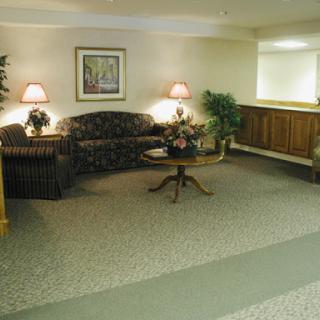 A cozy lobby area featuring comfortable seating and warm lighting.